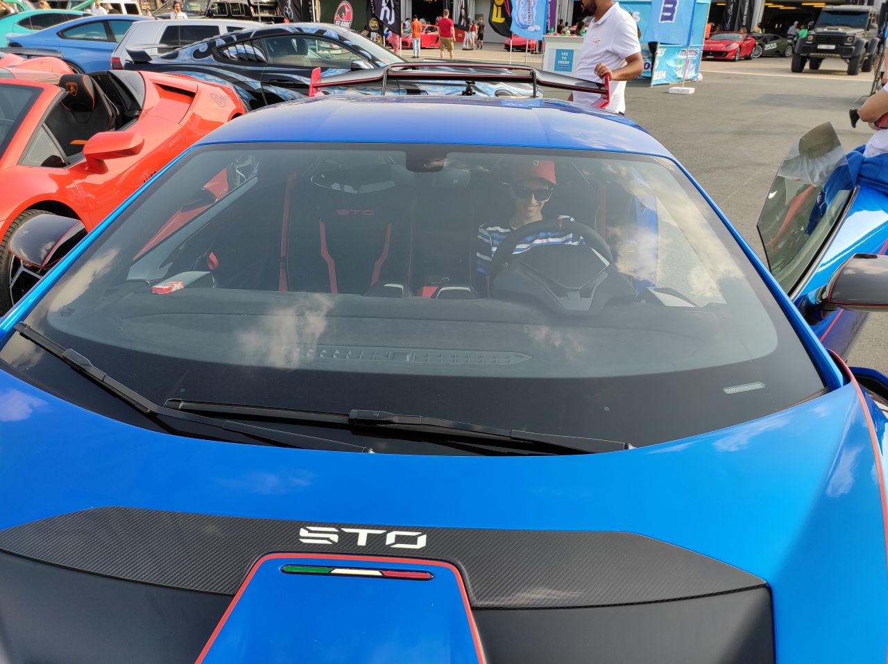 A young man sitting inside a Lamborghini