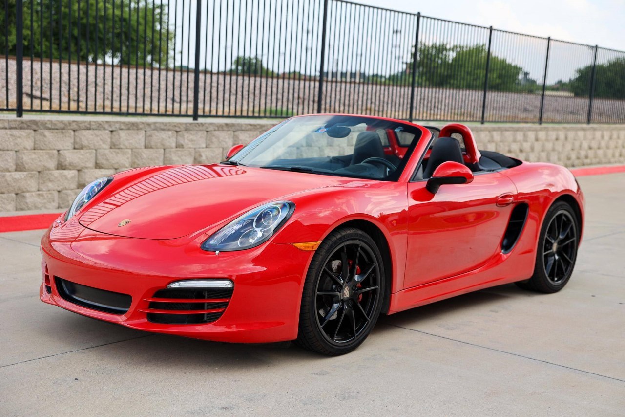 A red 981 Porsche Boxster GTS