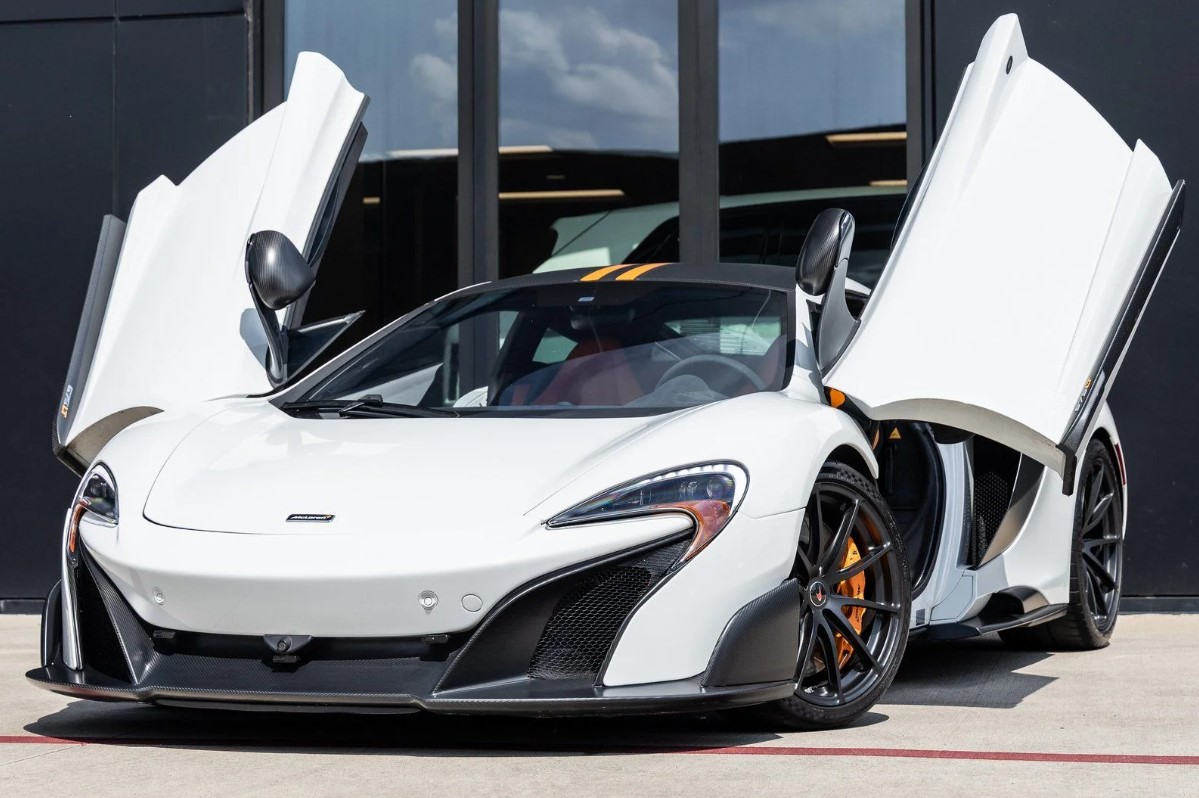 A white McLaren 675LT with its butterfly doors open